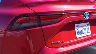 Close-up of Mirai badge on rear of car