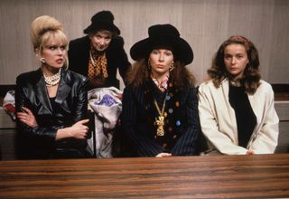 a group of women in fancy outfits sit in pews in the tv show Absolutely Fabulous