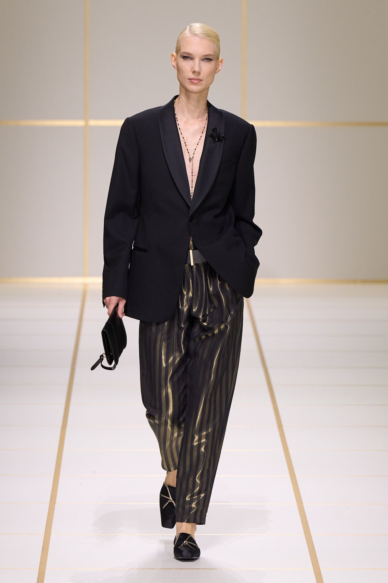 A model walks the giorgio armani s/s 27 runway.