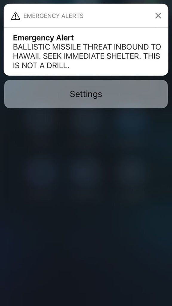 A screen shot take by Hawaiian citizen Alison Teal shows the screen of her mobile phone with a false alert text message sent to all Hawaiian citizens on January 13, 2018. 