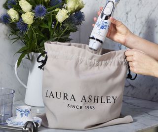 A Laura Ashley & VQ immersion blender being put in a bag