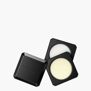 Jo Malone solid perfume in black refillable packaging against grey background. One image shows the all black case cover and the other 2 images shows content of the case