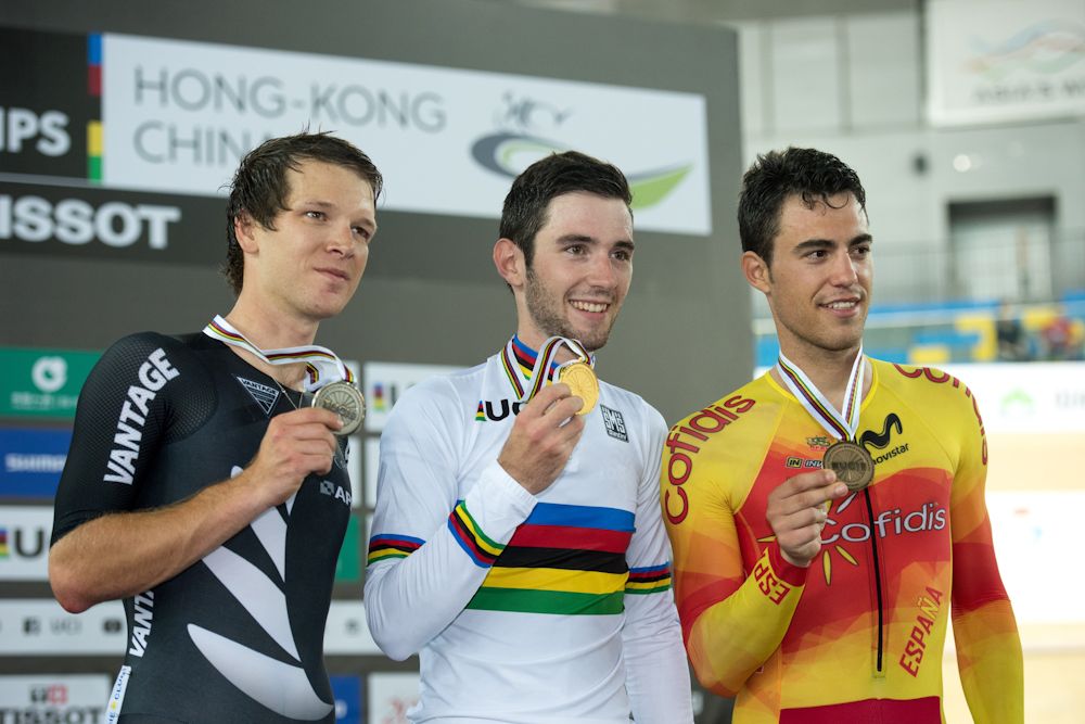 Gold medallist France's Benjamin Thomas (C) is flanked by Silver medallist New Zealand's Aaron Gate (L) and Bronze medallist Spain's Albert Torres Barcelo (R) as they pose during the medal ceremony for the Men's Omnium at the 2017 Track Cycling World Championships