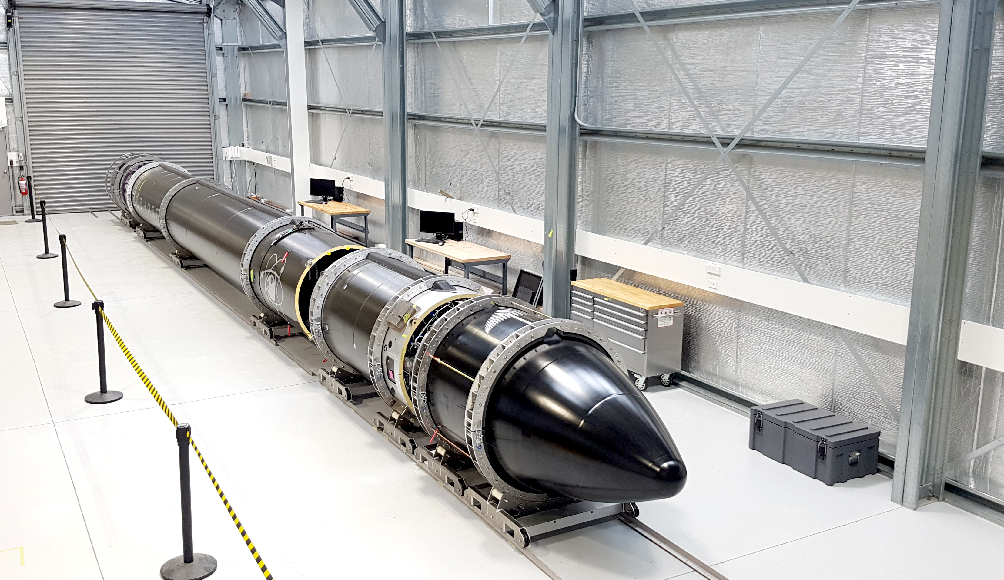 An Electron rocket (named &quot;It&#039;s a Test&quot;) arrives at Rocket Lab&#039;s launch complex ahead of the company&#039;s first test flight