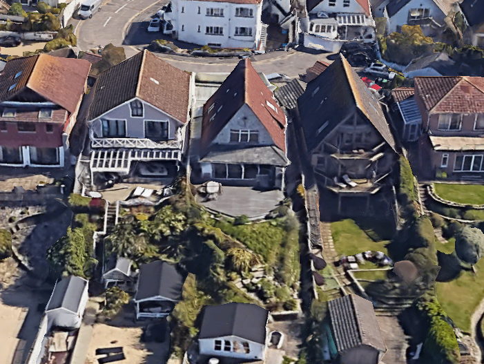 A balcony being installed on a house on a row of long gardened houses in Poole, Dorset by the sea