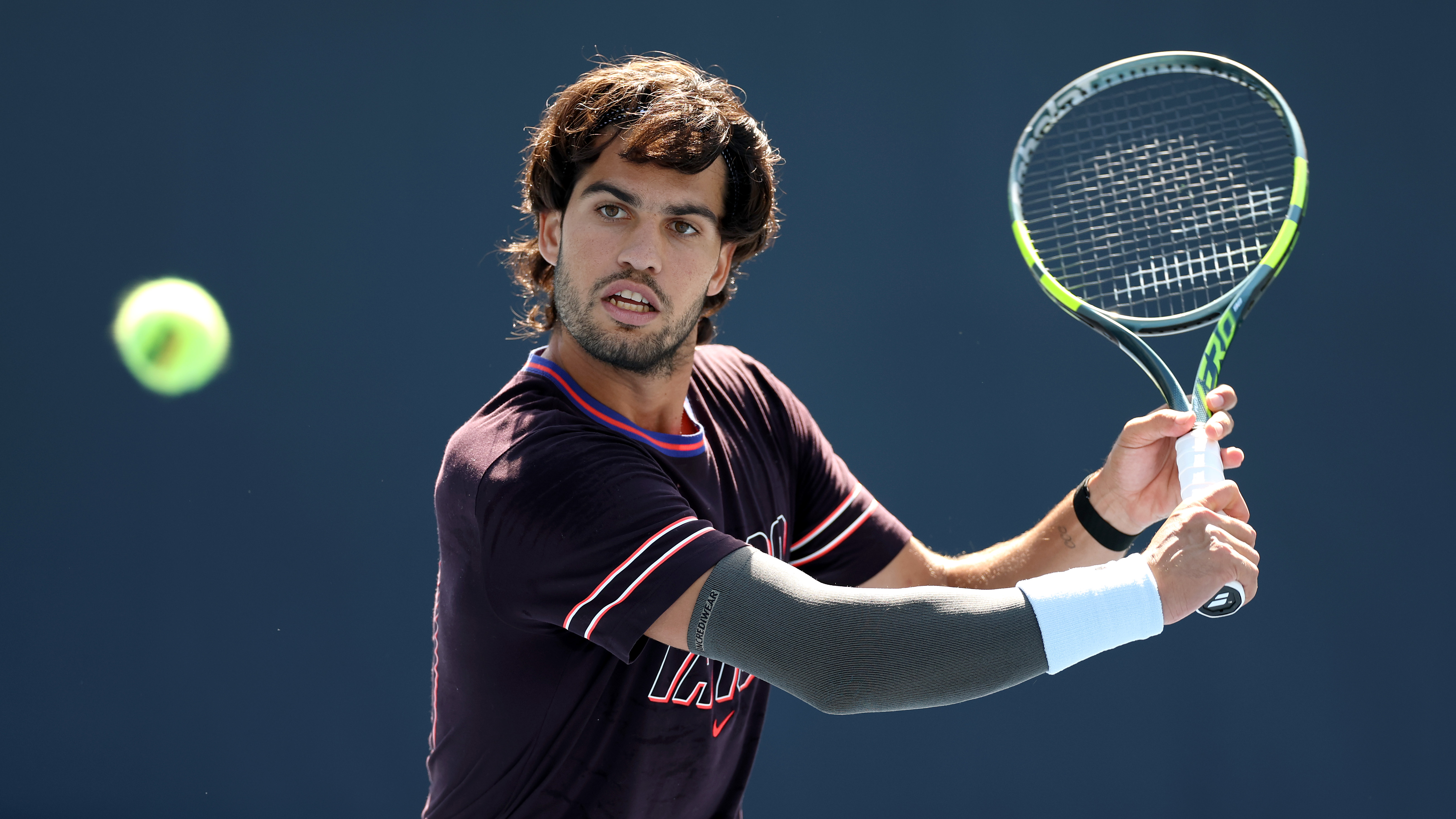Carlos Alcaraz of Spain returns a shot in a practice session during Fan Week at the USTA Billie Jean King National Tennis Center