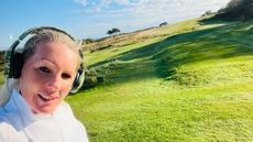 Carly Cummins wearing headphones