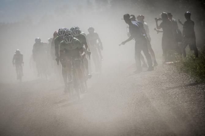 Fans cheer as riders come through today's dirt road section
