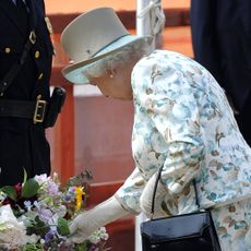 Queen Elizabeth laying a wreath at the 9/11 memorial