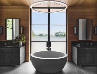 A bathroom with shiplap walls and a modern tub