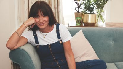 Davina McCall sat on a sofa