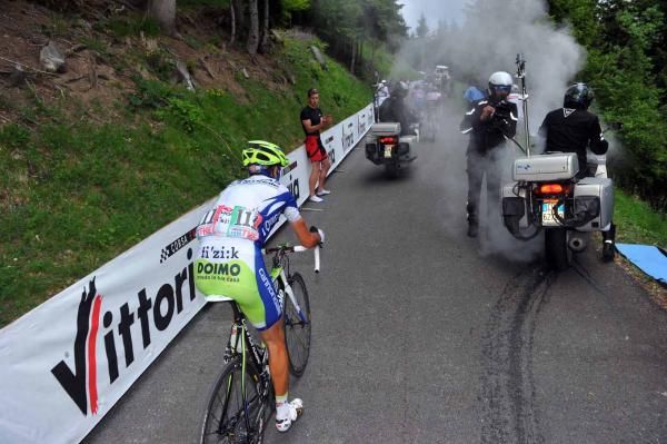 Vincenzo Nibali chases Alberto Contador and Michele Scarponi on the Zoncolan, while a motor bike engine gives out at the roadside.