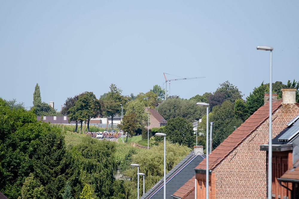 Race still neutralised as the peloton appear through the rooftops at the 108 km Stage 2 of the Lotto Belgium Tour 2016