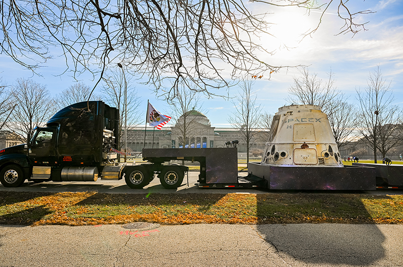 A semi truck pulls up in front of the Museum of Science and Industry in Chicago, Illinois, with the SpaceX Dragon cargo spacecraft going on display in the museum's Henry Crown Space Center in the spring of 2023.