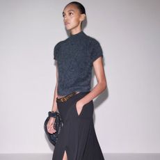 model wearing me+em pleated skirt and knit tee