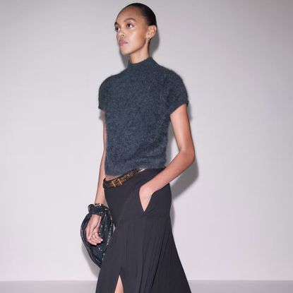 model wearing me+em pleated skirt and knit tee