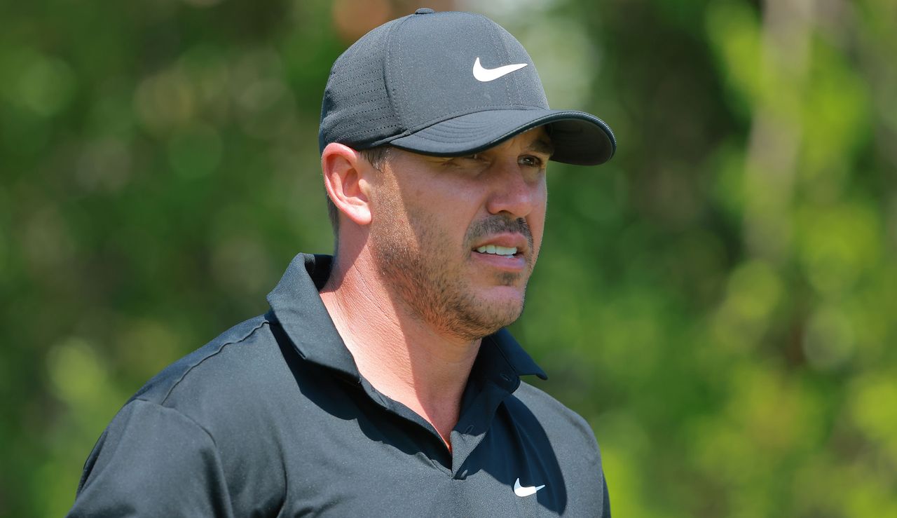 Koepka stares on in a black top