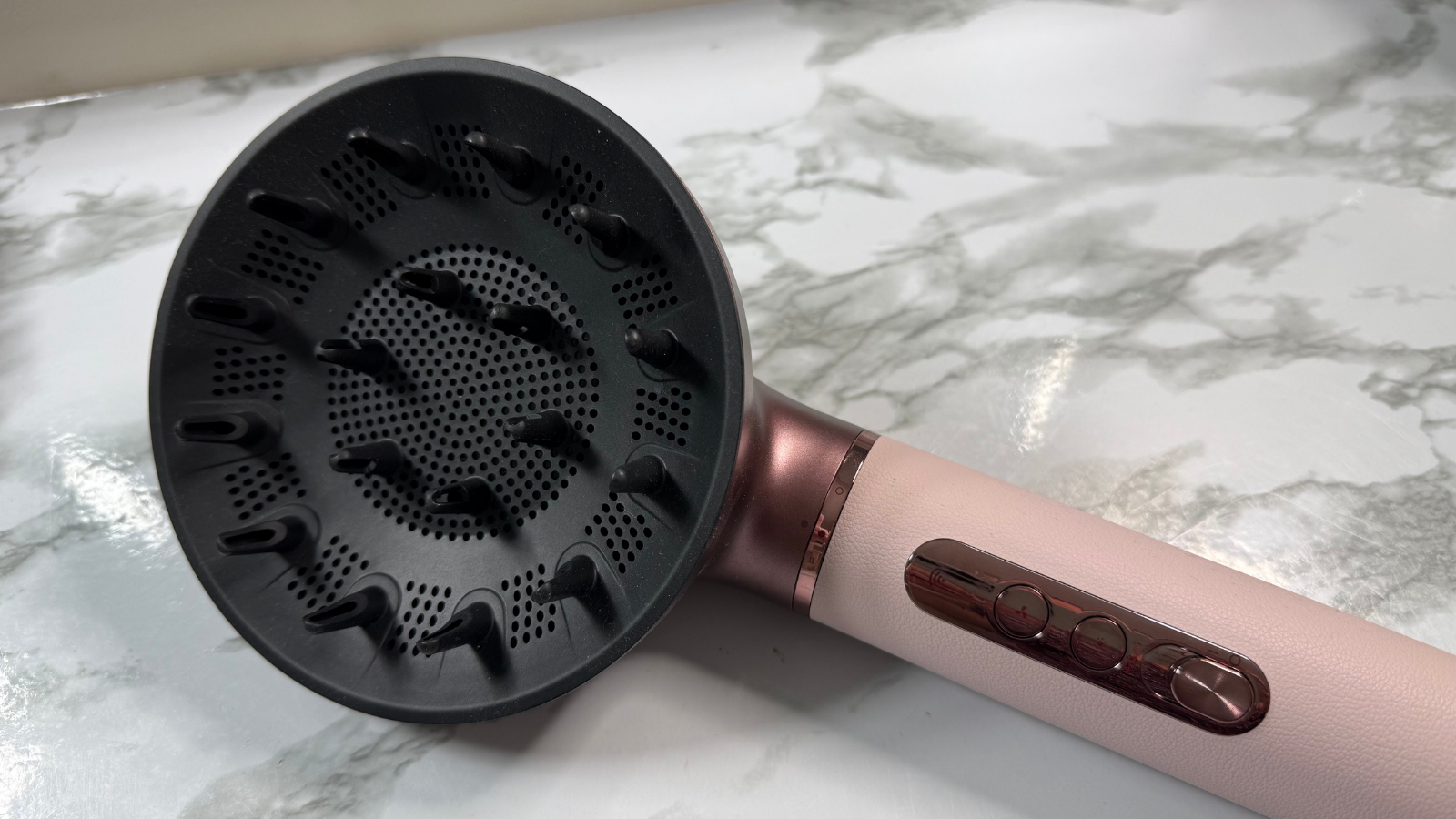 Dreame AirStyle Era fitted with the diffuser attachment showing the control buttons and handle design