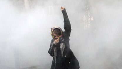 An Iranian women protests at Tehran's main university