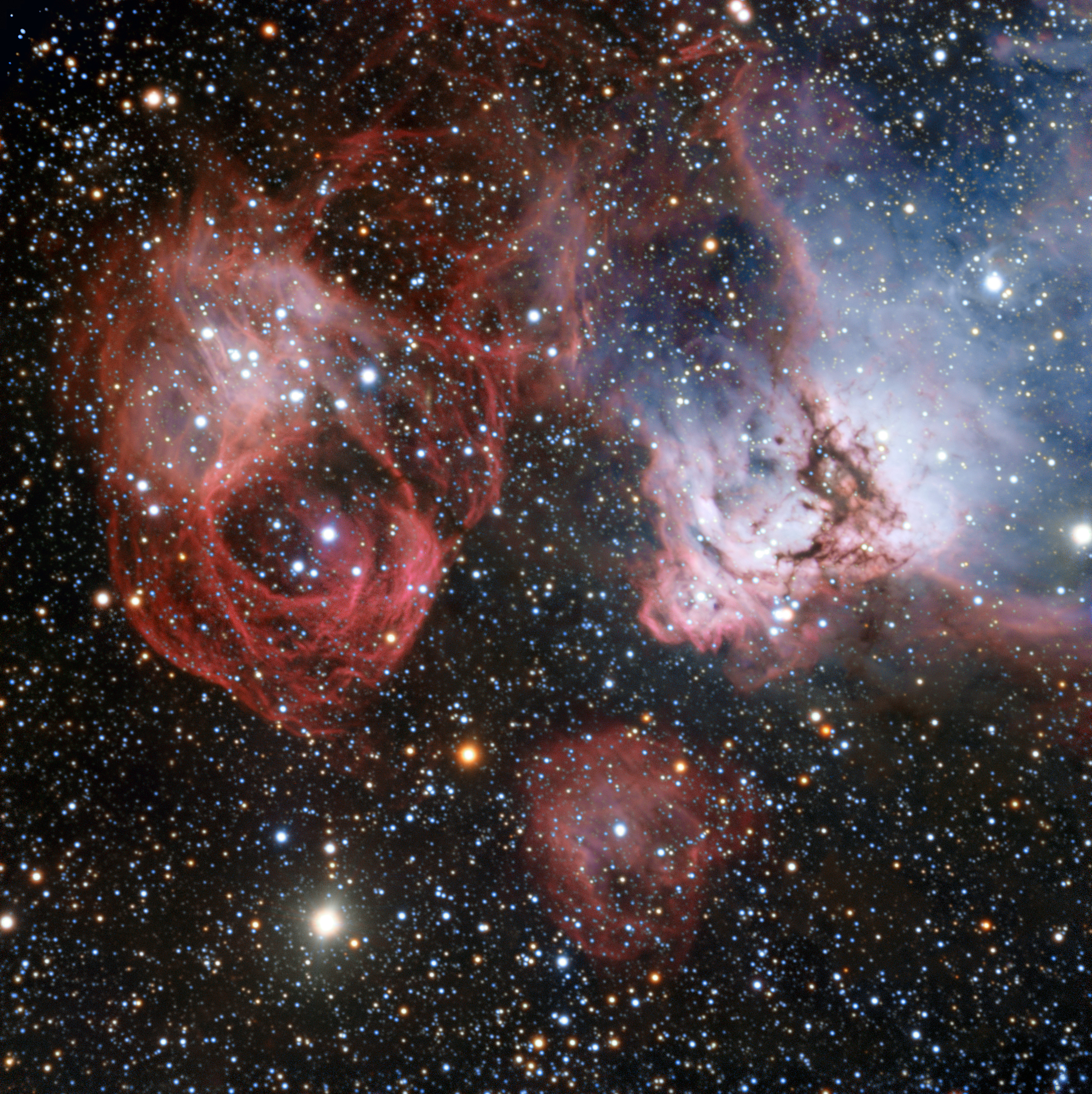 This photo shows the remnants of a stellar explosion (left) and new stars emitting intense radiation that makes clouds of gas glow around them (right) in the Large Magellanic Cloud. Image released Nov. 27, 2013.