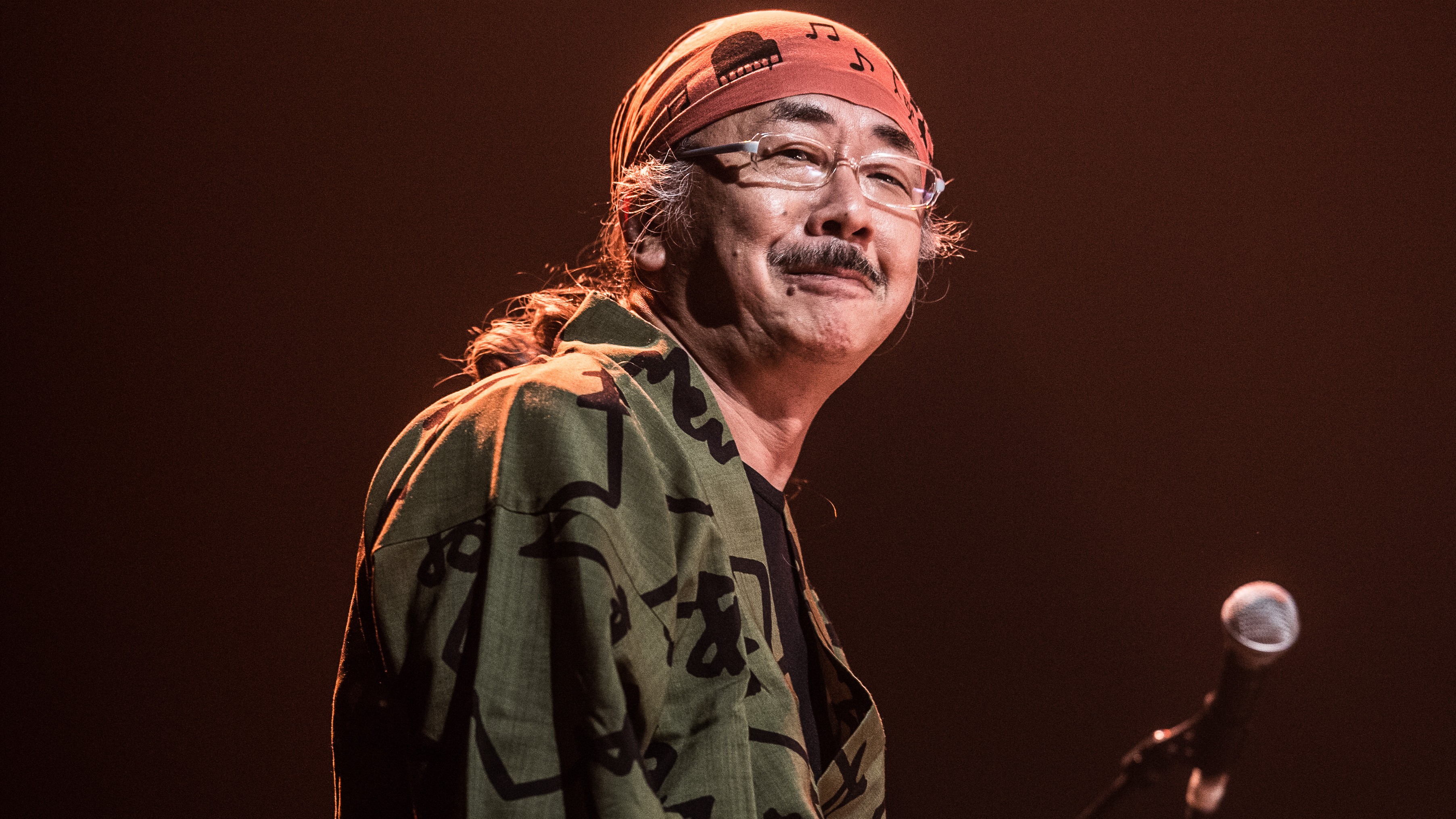 Nobuo Uematsu grinning at a concert
