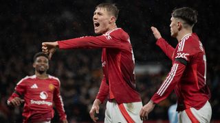 Manchester United players celebrate a goal ahead of the Man City vs Man Utd live stream