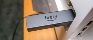 Amazon Fire TV Stick 4K Max plugged horizontally into TV