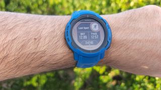 The Garmin Instinct 2 Solar in its sport mode and activity measurement screen