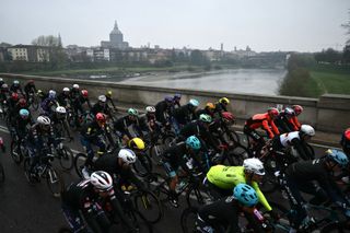 Riders cross the Po river during the start of the Milan - Sanremo one-day classic cycling race, in Pavia, near Milan, on March 22, 2025. (Photo by Marco BERTORELLO / AFP)