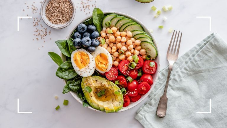 A bowl of healthy food including eggs and chickpeas, which are part of the 80/20 diet rule