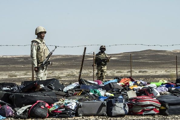 Soldiers stand over luggage from the Metrojet plane that crashed in Egypt&amp;#039;s Sinai Peninsula.