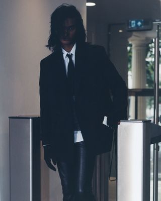 Man in suit in office turnstyle