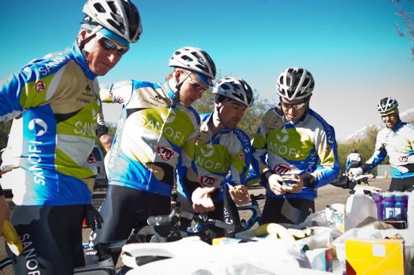 Team members grab snacks in the morning for the training ride.