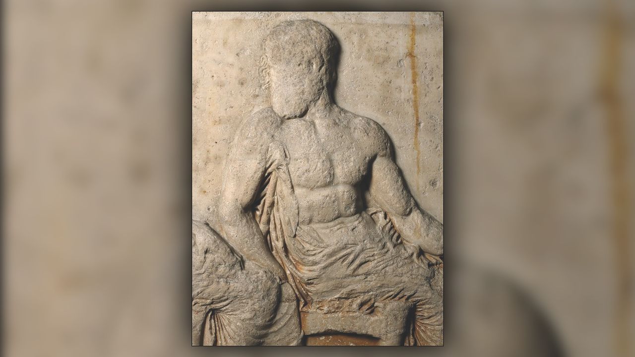A fifth-century-B.C. frieze of the Parthenon in Athens showing the disabeled god Hephaestus with a crutch tucked under his right arm.