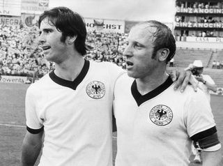 Germany's strikers Gerd Mueller (L) and Uwe Seeler after the match.