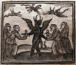 Devil Giving Puppets to Witches