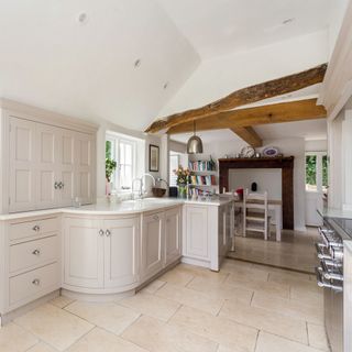 kitchen room with white walls and tiled flooring