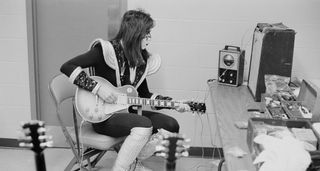 Ace Frehley plays his 1975 Les Paul Custom backstage in '77.