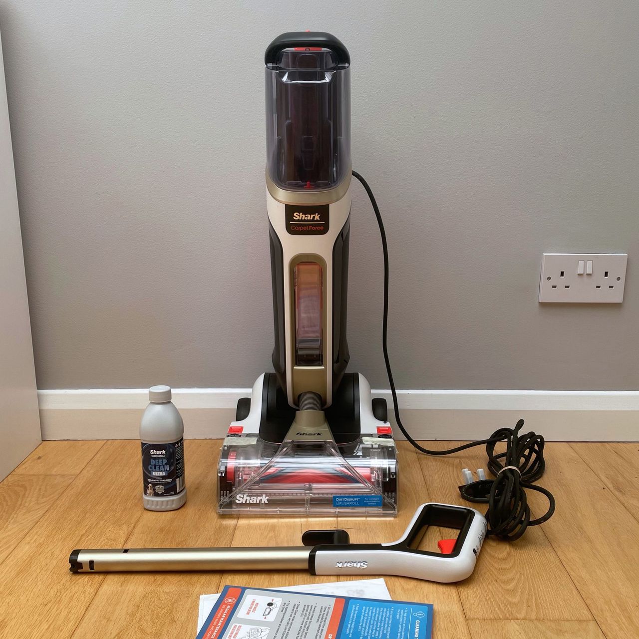 Shark CarpetForce Upright Carpet Cleaner sitting on wooden flooring
