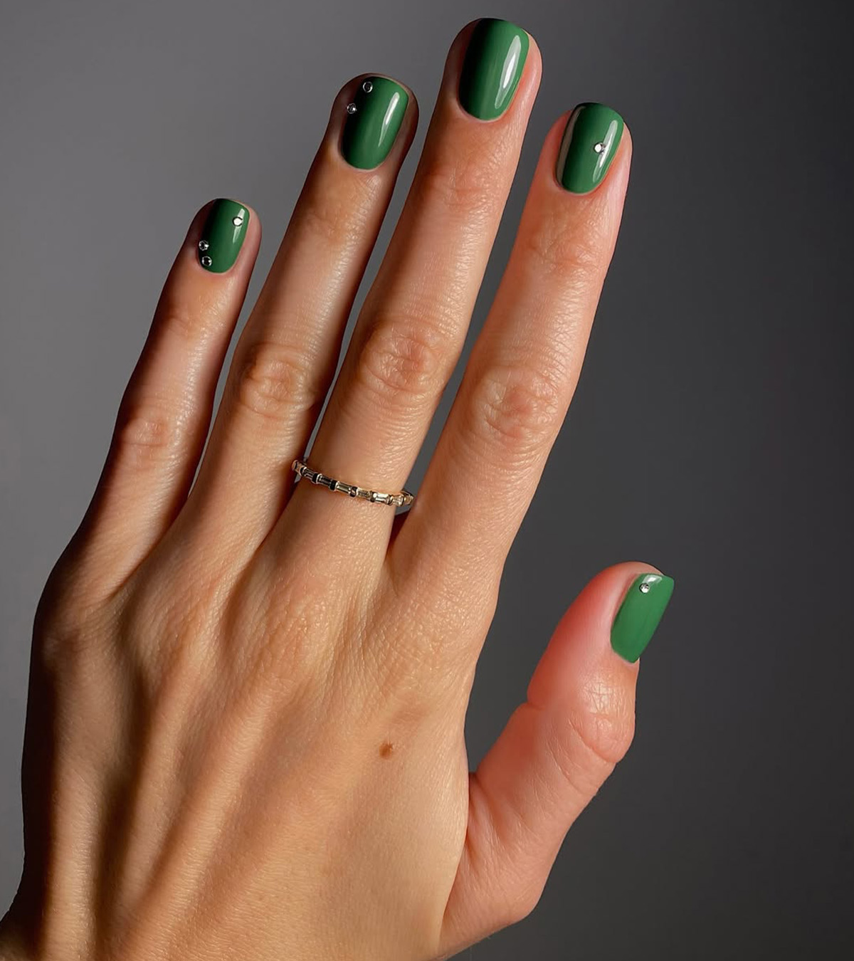 A festive green manicure by Mateja Novakovic.