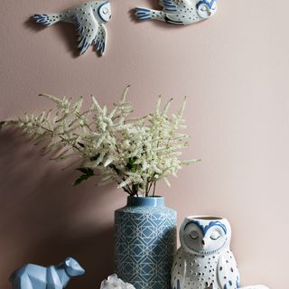 pink wall flower pot and designed animal and birds