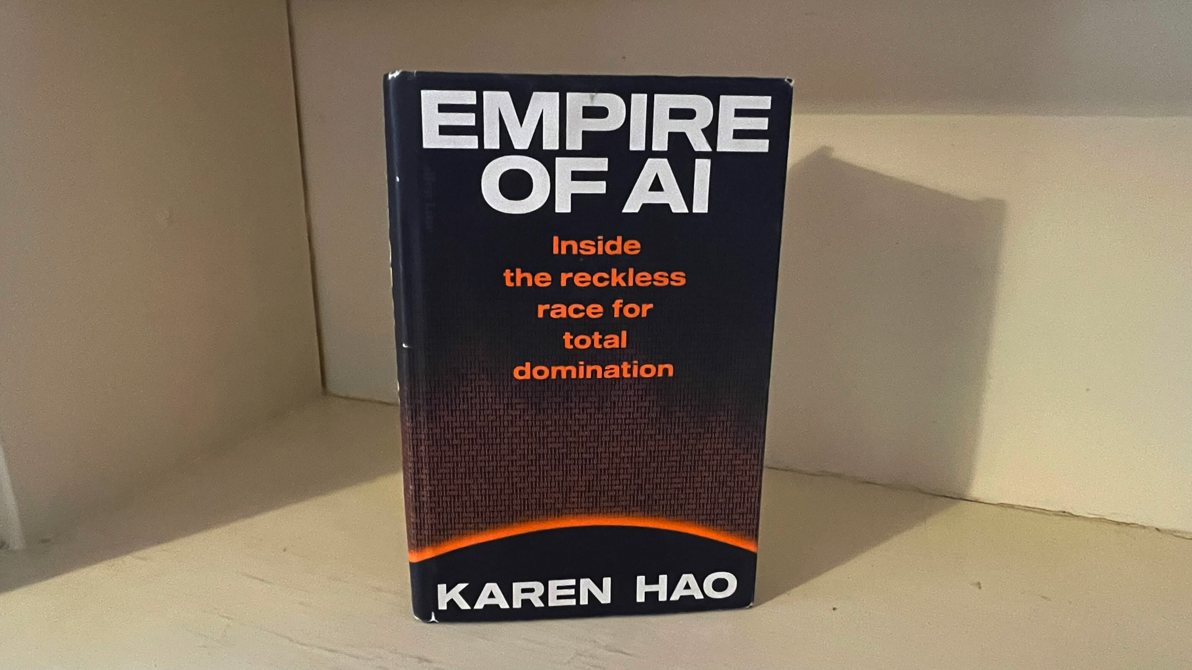 Empire of AI book on a desk