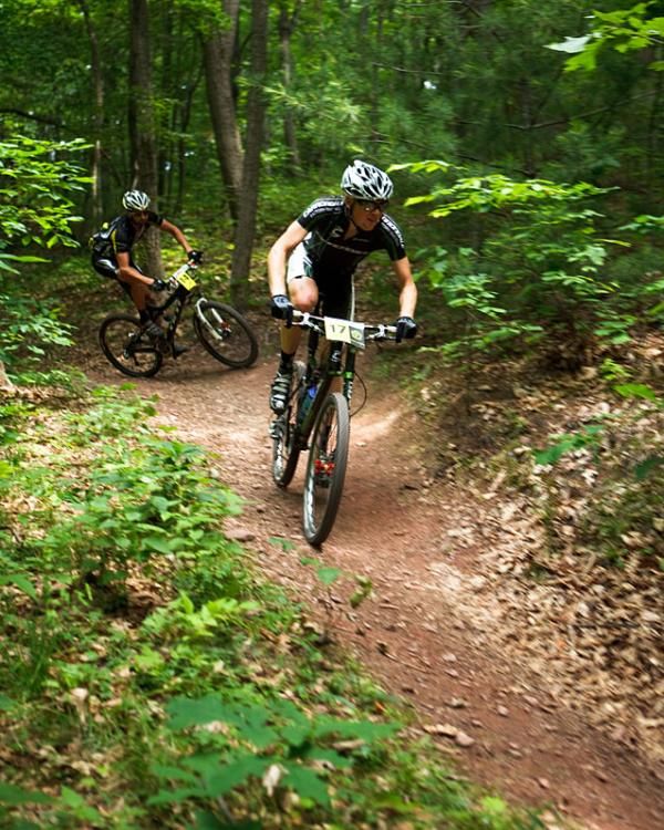 Alex Grant (Cannondale Factory Racing) leads Drew Edsell (Yeti) through an Allegrippis Trail at Raystown Lake.