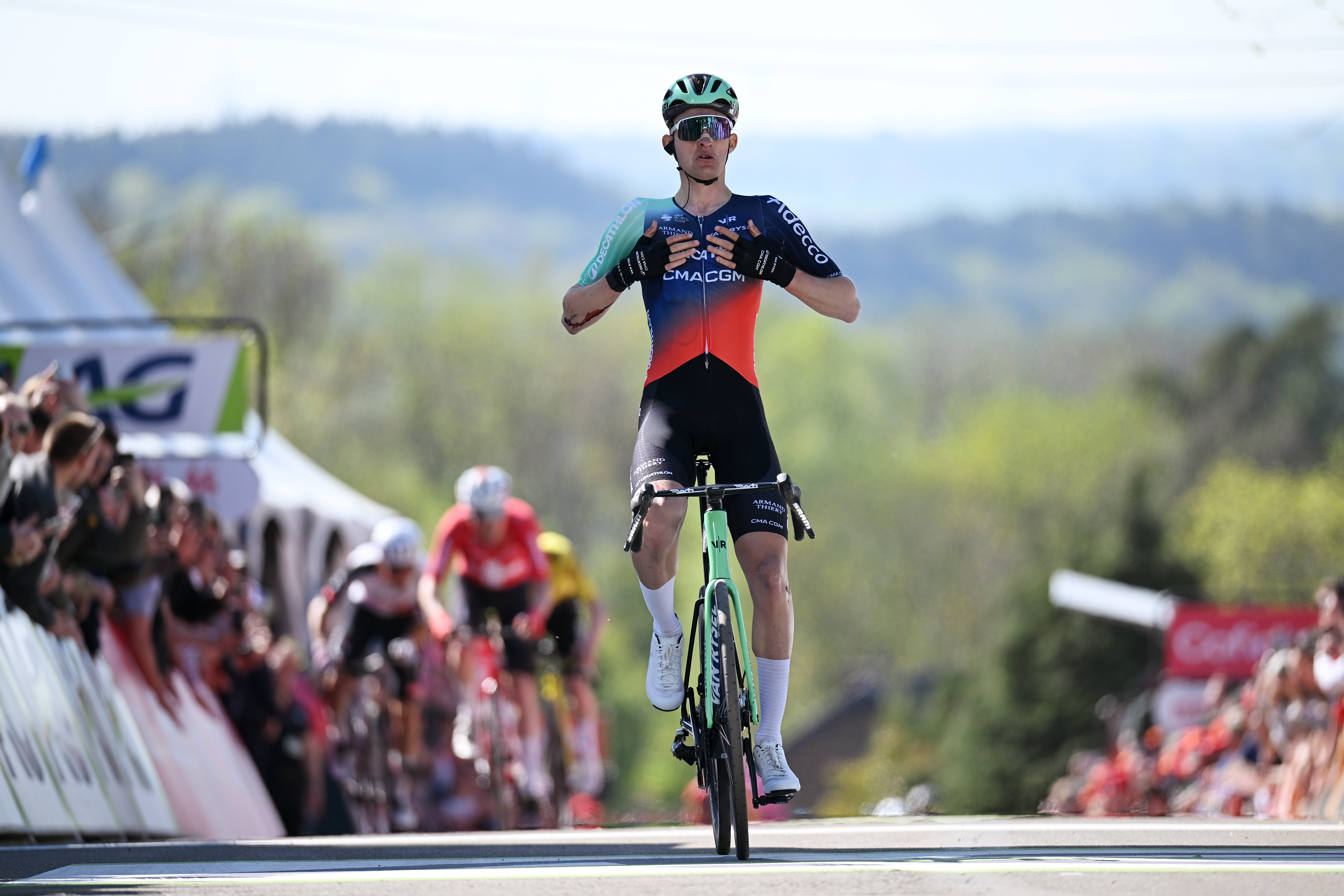 Paul Seixas of France and Decathlon CMA CGM celebrates at finish line as race winner during the 90th La Fl&egrave;che Wallonne