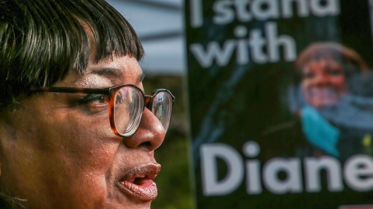 Diane Abbott is pictured in Hackney Downs Park posing for photographs with campaign posters bearing the slogan &quot;I stand with Diane&quot;.