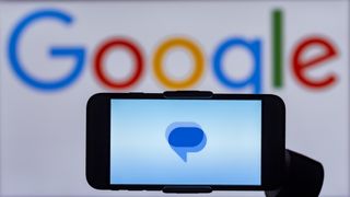 Google Messages logo on a smartphone screen in front of the Google branding