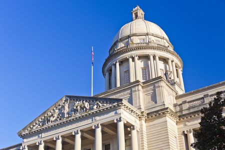 Kentucky state capitol building against bright blue sky