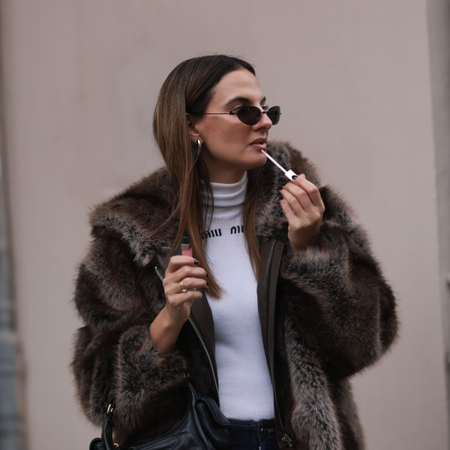 Beauty Dupes Anna Winter applying lip gloss on November 29, 2024 in Berlin, Germany. 