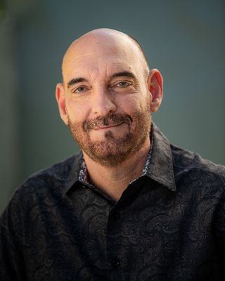 Headshot of Adam Castillo.