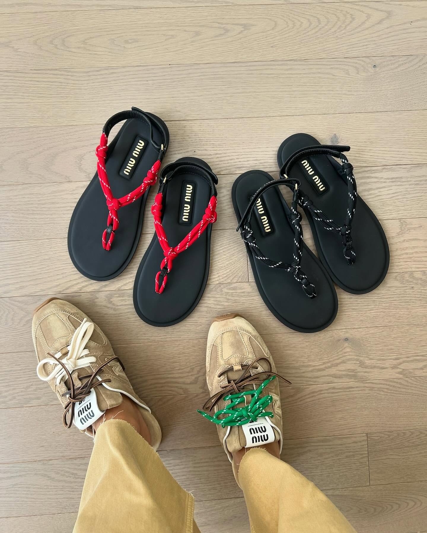 Woman wearing Miu Miu x New Balance paracord sneakers standing next to paracord thong sandals.